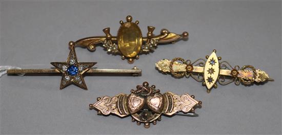 Four assorted late 19th/early 20th century 9ct gold bar brooches, three gem set including diamonds, largest 5cm.